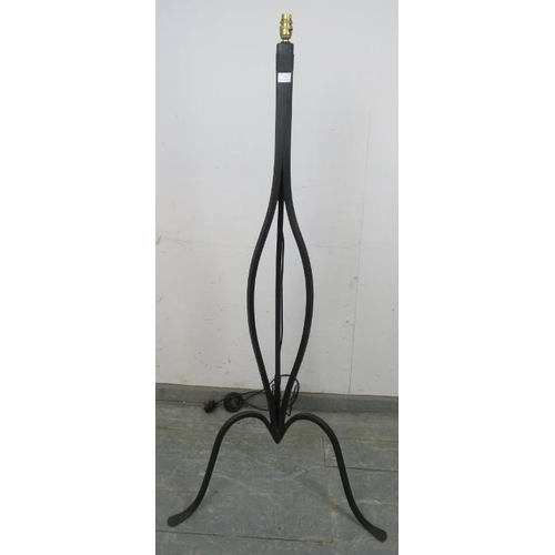 874 - An ornate wrought iron standard lamp, no shade.
H144cm (approx). Sold electronically untested.