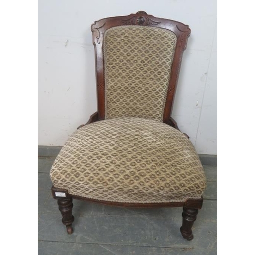 878 - A late Victorian mahogany show-wood bedroom chair, reupholstered in patterned chenille material, on ... 