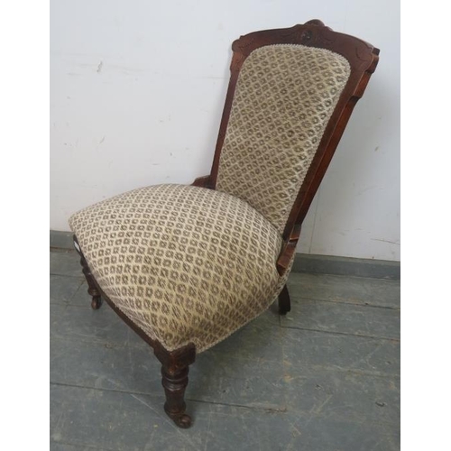 878 - A late Victorian mahogany show-wood bedroom chair, reupholstered in patterned chenille material, on ... 