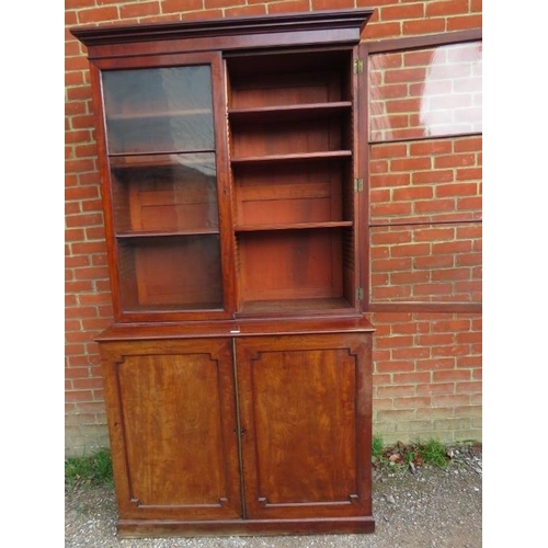 882 - A large 19th century mahogany glazed bookcase of good colour, the top section with stepped cornice a... 