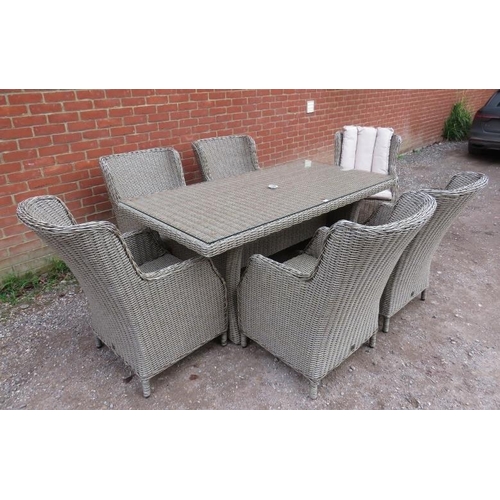 890 - A good quality wicker garden set by LG Outdoor, comprising a glass-topped table and six armchairs, a... 