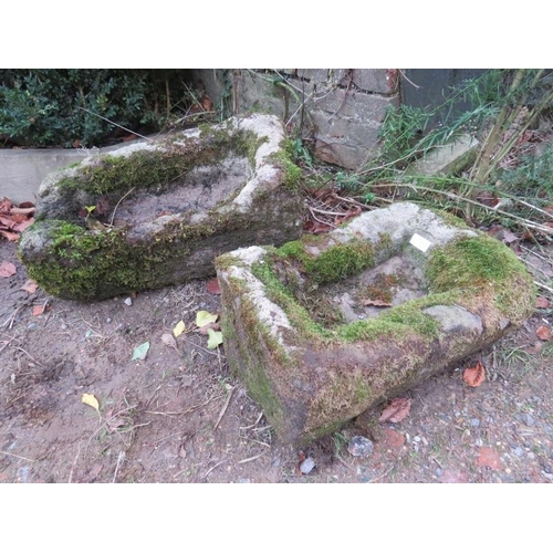 895 - A near pair of ancient hand-hewn stone troughs. 
Largest H22cm W60cm D32cm (approx).
Condition: Exte... 