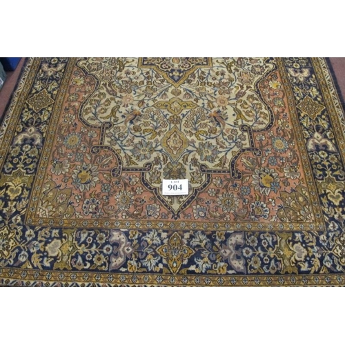 904 - A central Persian Isfahan carpet central floral motif cream, red, blue, with wide borders. In good c... 