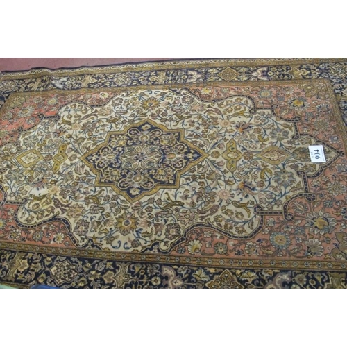 904 - A central Persian Isfahan carpet central floral motif cream, red, blue, with wide borders. In good c... 