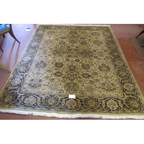 914 - A late 20th century Indian pure wool carpet. Central block pattern of foliage on a deep cream ground... 