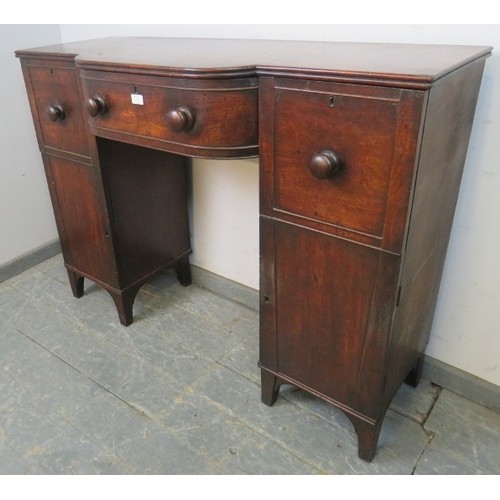 746 - A Regency Period mahogany pedestal sideboard of small proportions, having a reeded edge above bow-fr... 