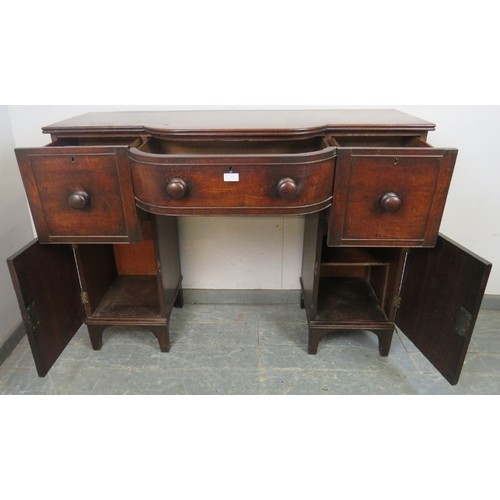 746 - A Regency Period mahogany pedestal sideboard of small proportions, having a reeded edge above bow-fr... 