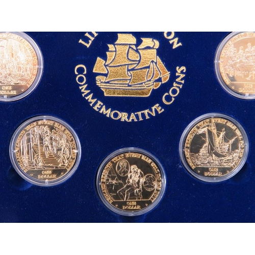 123 - A Life of Nelson Commemorative Coins Set. Eight gilt metal one dollar coins housed in a matching dis... 