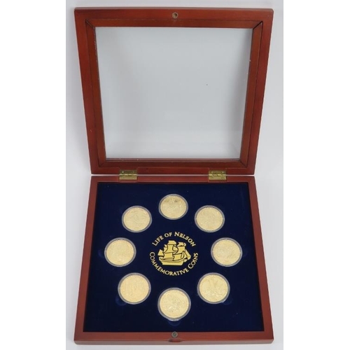 123 - A Life of Nelson Commemorative Coins Set. Eight gilt metal one dollar coins housed in a matching dis... 