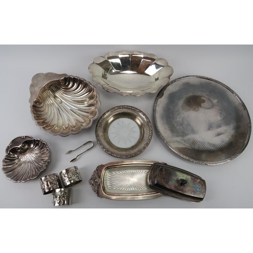 129 - A group of plated silver items. Items included trays, dishes, tongs and three Art Nouveau napkin rin... 