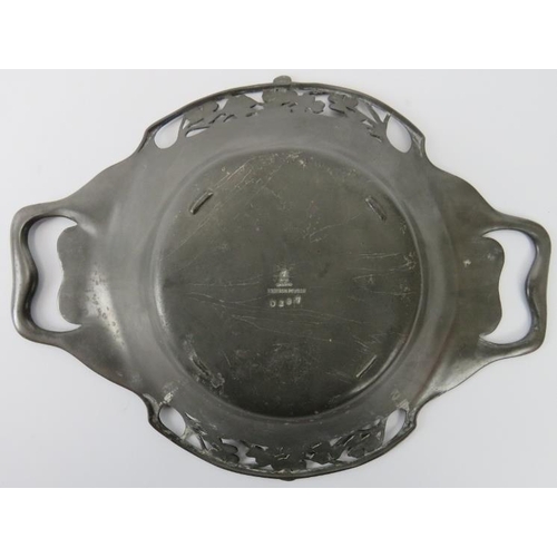 131 - An English Art Nouveau pewter twin handled bowl, early 20th century. With foliate clover decoration.... 