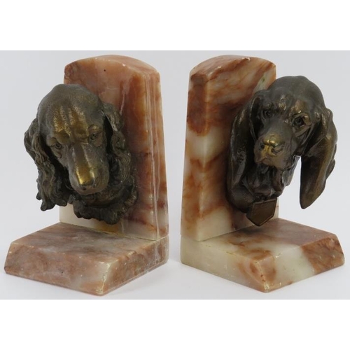 14 - A pair of vintage bronzed spelter and alabaster spaniel and hound dog bookends, 20th century. Both s... 