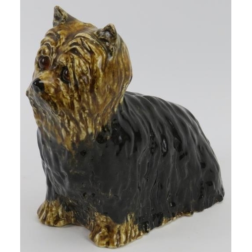 15 - A Winstanley ceramic Yorkshire Terrier. Modelled with glass eyes. Signed and marked ‘5 England’ bene... 