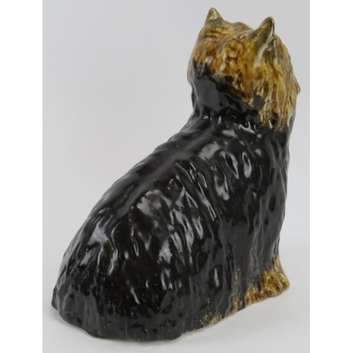 15 - A Winstanley ceramic Yorkshire Terrier. Modelled with glass eyes. Signed and marked ‘5 England’ bene... 