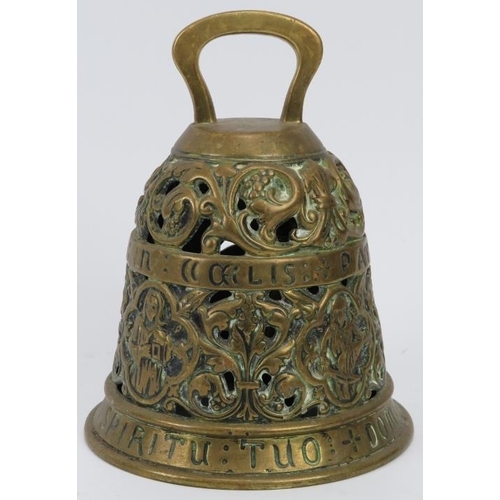 151 - An ecclesiastical brass bell, 19th century. Cast in openwork with inscribed bands in Latin reading ‘... 