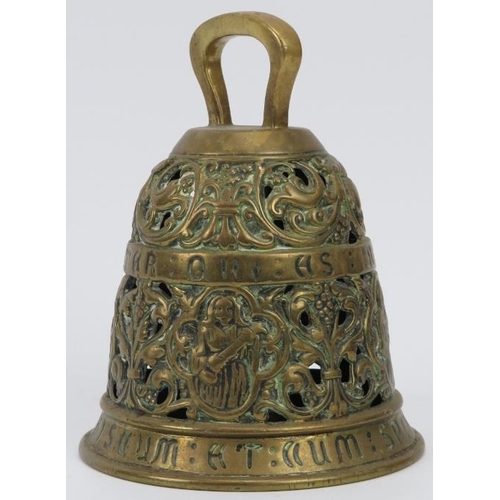 151 - An ecclesiastical brass bell, 19th century. Cast in openwork with inscribed bands in Latin reading ‘... 