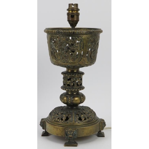 152 - An ecclesiastical brass chalice table lamp, 19th century. Later converted into a table lamp. 33 cm h... 