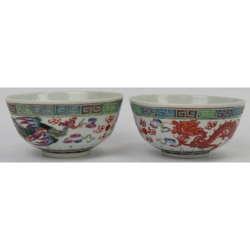 172 - Two Chinese enamelled porcelain bowls, 20th century. Each painted with a confronting dragon and phoe... 