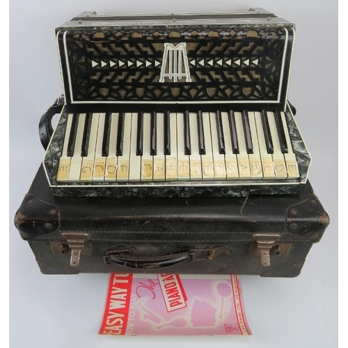 199 - An Italian accordion by Lombardi with case. 44.5 cm approximate width. Case: 49.5 cm width. 
Conditi... 