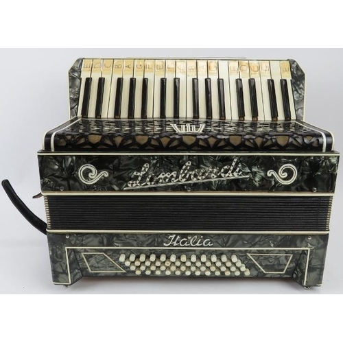 199 - An Italian accordion by Lombardi with case. 44.5 cm approximate width. Case: 49.5 cm width. 
Conditi... 