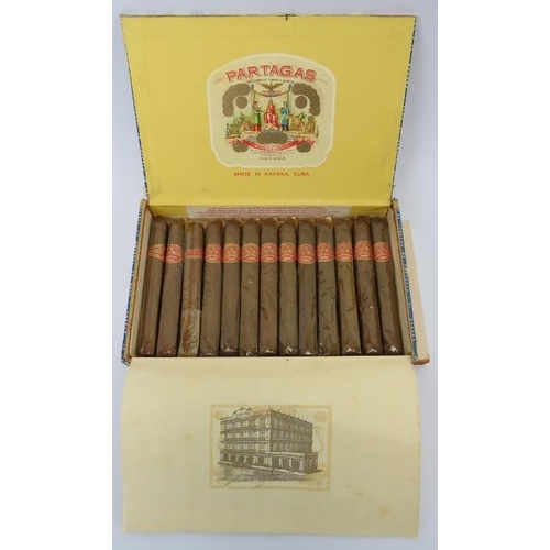 2 - A box of thirteen vintage Partagas Cuban Havana cigars. Each cigar wrapped in cellophane. 
Condition... 