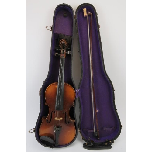 204 - A violin with case, probably late 19th/early 20th century. With faux Antonius Stradivarius’ internal... 