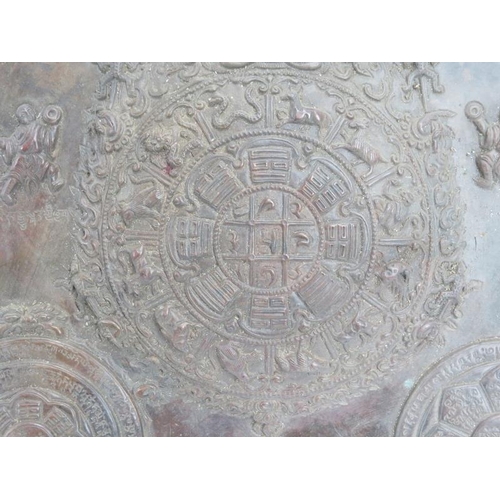 209 - A Tibetan Buddhist embossed copper Mandala panel, probably 19th century. Depicting Buddhist symbols ... 