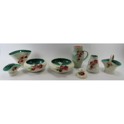 240 - A group of Bretby Blossom ceramics wares, early 20th century. Items include a wall pocket, bowls, a ... 