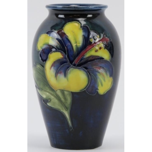 261 - A Walter Moorcroft Hibiscus pattern vase, circa 1950/60s. Tubeline decorated with Hibiscus against a... 