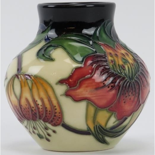 271 - A Moorcroft Anna Lily pattern vase designed by Nicola Slaney, circa 2010. Painted and impressed fact... 