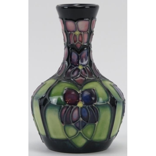 275 - A Moorcroft Violet pattern vase designed by Sally Tuffin, circa 1998. Painted and impressed factory ... 