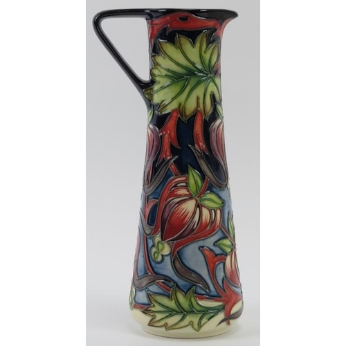 279 - A Moorcroft Red Ribbons pattern ewer designed by Shirley Hayes, circa 2004. Painted and impressed fa... 