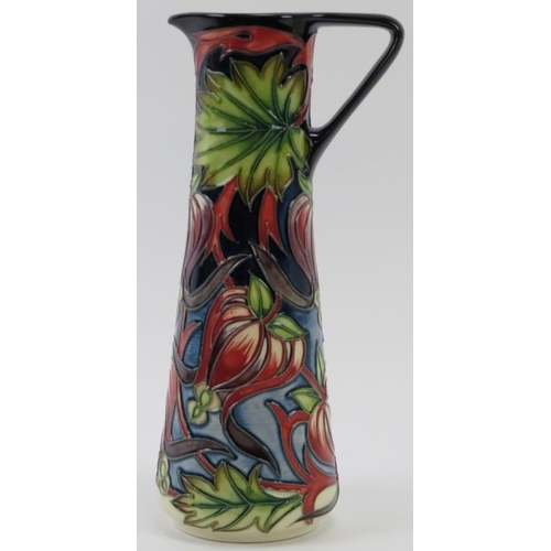 279 - A Moorcroft Red Ribbons pattern ewer designed by Shirley Hayes, circa 2004. Painted and impressed fa... 