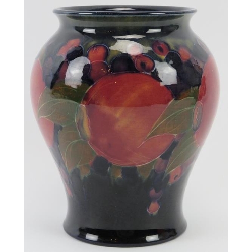 284 - A William Moorcroft Burslem Pomegranate pattern vase, circa 1916. Signed W. Moorcroft in green with ... 