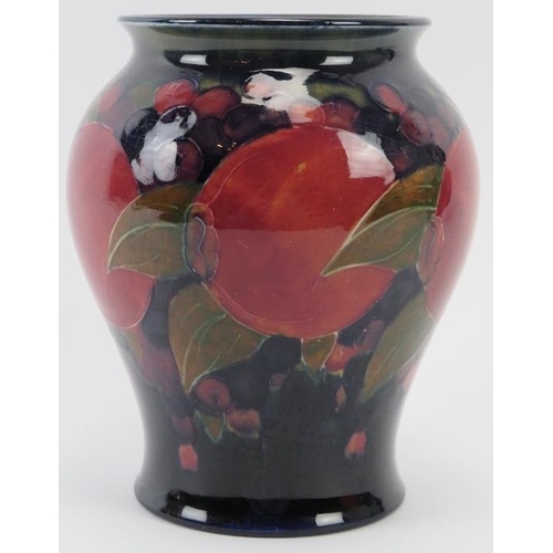 284 - A William Moorcroft Burslem Pomegranate pattern vase, circa 1916. Signed W. Moorcroft in green with ... 