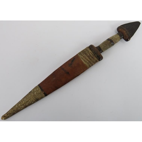 29 - Tribal Art: An African dagger, probably Hausa people, Nigeria. The pommel formed from the tip of a b... 