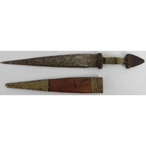 29 - Tribal Art: An African dagger, probably Hausa people, Nigeria. The pommel formed from the tip of a b... 