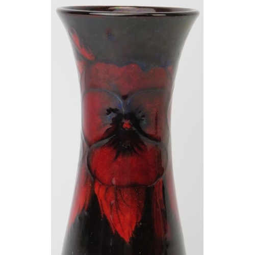 291 - A William Moorcroft flambe glazed Pansy pattern vase, circa 1920s. Initialled W. M. in blue with imp... 