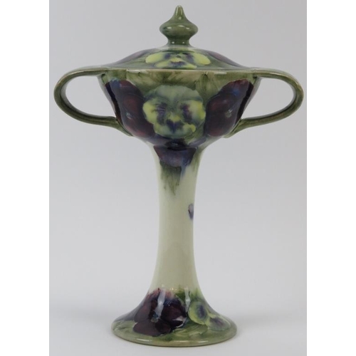 294 - A William Moorcroft Burslem Pansy pattern twin handled vase with cover, circa 1916. 22.5 cm height, ... 