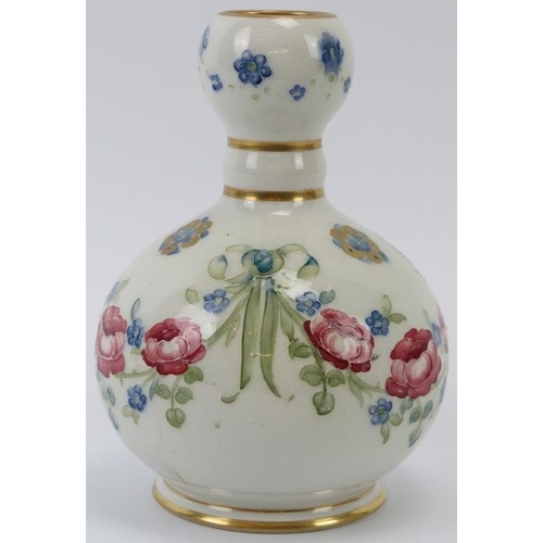 299 - A William Moorcroft Rose Garland pattern knopped vase, circa 1904. Gilt decorated with rose and forg... 