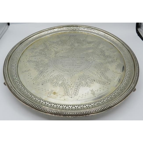 301 - A large silver engraved salver with bead edge & pierced decoration sitting on three feet, Sheffield ... 