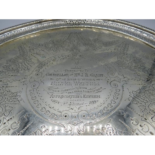 301 - A large silver engraved salver with bead edge & pierced decoration sitting on three feet, Sheffield ... 