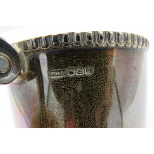 304 - A silver christening mug on pedestal foot & double scroll handle, Sheffield 1924, engraved on side. ... 