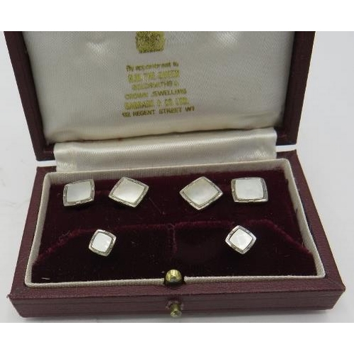 314 - A 9ct white gold & mother of pearl dress stud set, boxed. Approx weight 7.3 troy oz.
Condition repor... 