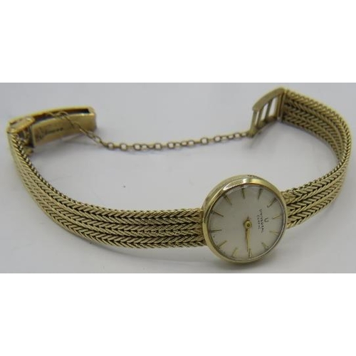 316 - A ladies 9ct gold watch 'Universal Genève' on a 9ct gold strap. Approx weight 20.6 grams.
Condition ... 