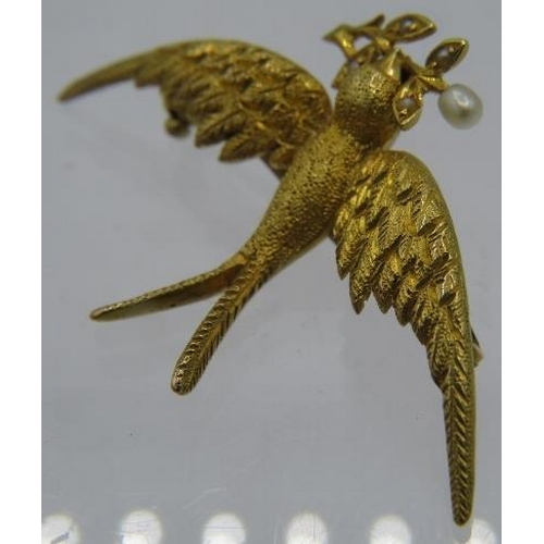 317 - A fine detailed 15ct yellow gold swallow brooch holding a seed  pearl set branch. Approx weight 4.2 ... 