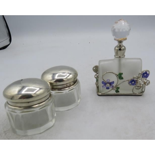 332 - A pair of panel cut silver top rouge pots, Birmingham 1926 and a frosted glass scent bottle with ena... 