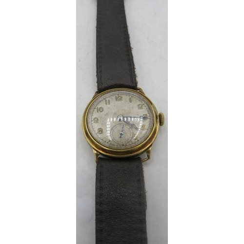 338 - A 9ct gold vintage Dennison wristwatch on a leather strap 11841 20295. Total weight 24 grams.
Condit... 