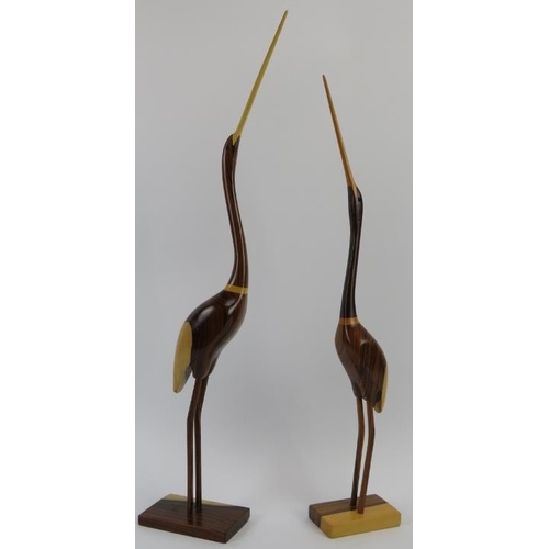 34 - Two Feathers Gallery carved wood abstract figures of birds, late 20th/21st century. 60.7 cm height, ... 