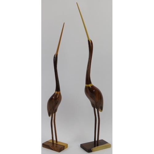 34 - Two Feathers Gallery carved wood abstract figures of birds, late 20th/21st century. 60.7 cm height, ... 